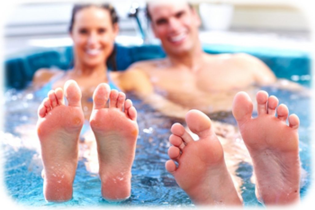 Young relaxed couple in jacuzzi. Spa.